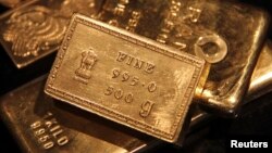 FILE - Gold bars are displayed at a gold jewelry shop in the northern Indian city of Chandigarh. (REUTERS/Ajay Verma )