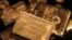 FILE - Gold bars are displayed at a gold jewelry shop in the northern Indian city of Chandigarh. 
