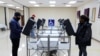 Voters cast their ballots in the U.S. Senate run-off election, at a polling station in Marietta, Georgia, Jan. 5, 2021. 