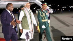 India's Prime Minister Narendra Modi is greeted by Papua New Guinea's Prime Minister James Marape at Jackson International Airport, at Papua New Guinea May 21, 2023. Papua New Guinea government/Handout via REUTERS