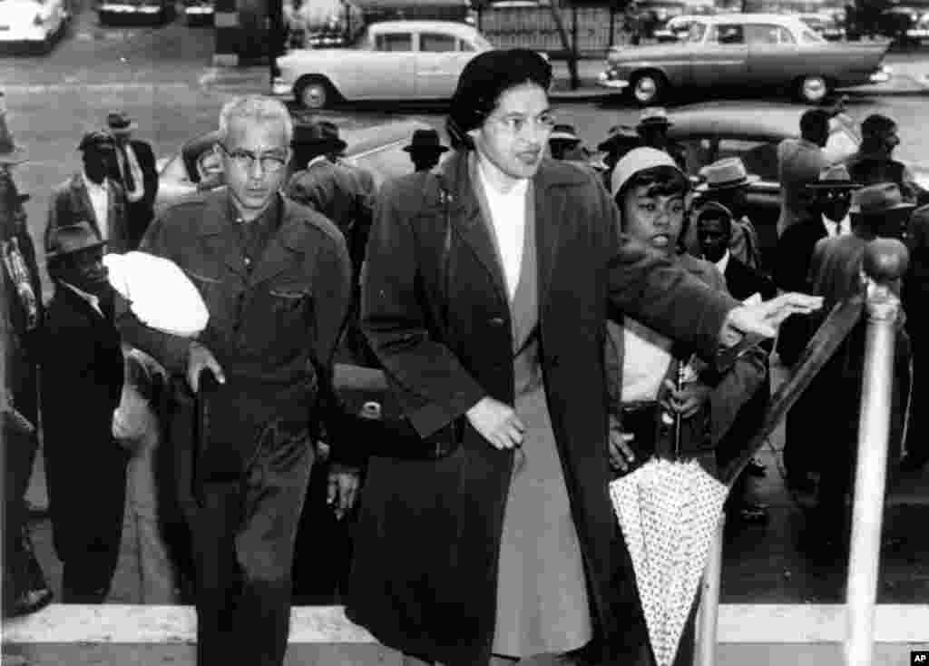 FILE -Rosa Parks arrives at circuit court to be arraigned in the racial bus boycott in Montgomery, Alabama, Feb. 24, 1956.