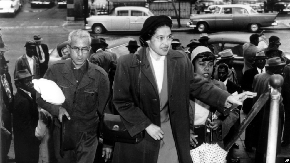 FILE -Rosa Parks arrives at circuit court to be arraigned in the racial bus boycott in Montgomery, Alabama, Feb. 24, 1956.