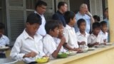 Students at En Komar Primary School in Kampong Thom province have receive breakfast on Tuesday, June 10, 2014. The breakfasts are part of a World Food Program initiative that aims to feed 3.5 million students by 2016.