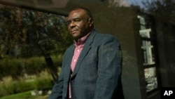 FILW - Former Congolese Vice President Jean-Pierre Bemba poses for a photograph after being interviewed by The Associated Press in Waterloo, Belgium, Sept. 11, 2018.