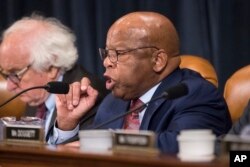 Rep. John Lewis, D-Ga., makes a point as the House Ways and Means Committee debates the Republican tax reform package, on Capitol Hill in Washington, Nov. 8, 2017.