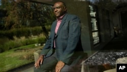 Former Congolese Vice President Jean-Pierre Bemba poses for a photograph after being interviewed by The Associated Press in Waterloo, Belgium, Sept. 11, 2018.