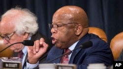 Rep. John Lewis, D-Ga., makes a point as the House Ways and Means Committee debates the Republican tax reform package, on Capitol Hill in Washington, Nov. 8, 2017.