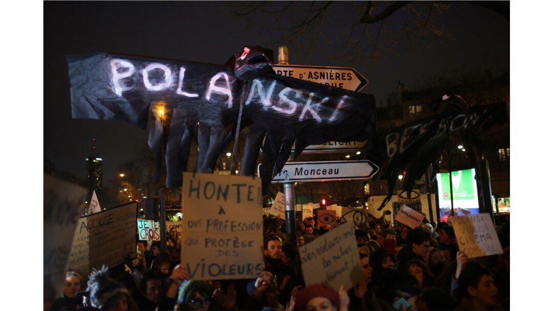 Women's rights activists protest against multiple nominations for Roman Polanski at the Cesar Awards ceremony, in Paris, France, Feb. 28, 2020.