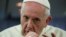 FILE: Pope Francis gestures during a news conference on board of the plane during his flight back from a trip to Chile and Peru, January 22, 2018.