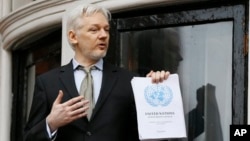 WikiLeaks founder Julian Assange speaks on the balcony of the Ecuadorean Embassy in London, Friday, Feb. 5, 2016. A U.N. human rights panel says Assange has been "arbitrarily detained" as he fights a warrant to answer rape charges in Sweden.