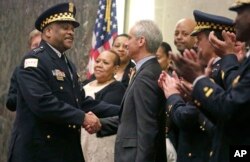 Eddie Johnson (left) and Rahm Emanuel at Johnson's swearing in as police superintendent.