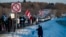 People gather along the trans-Canadian highway to show support for the "Freedom Convoy", protesting against Covid-19 related mandates in Rigaud, Quebec on Jan. 28, 2022. 