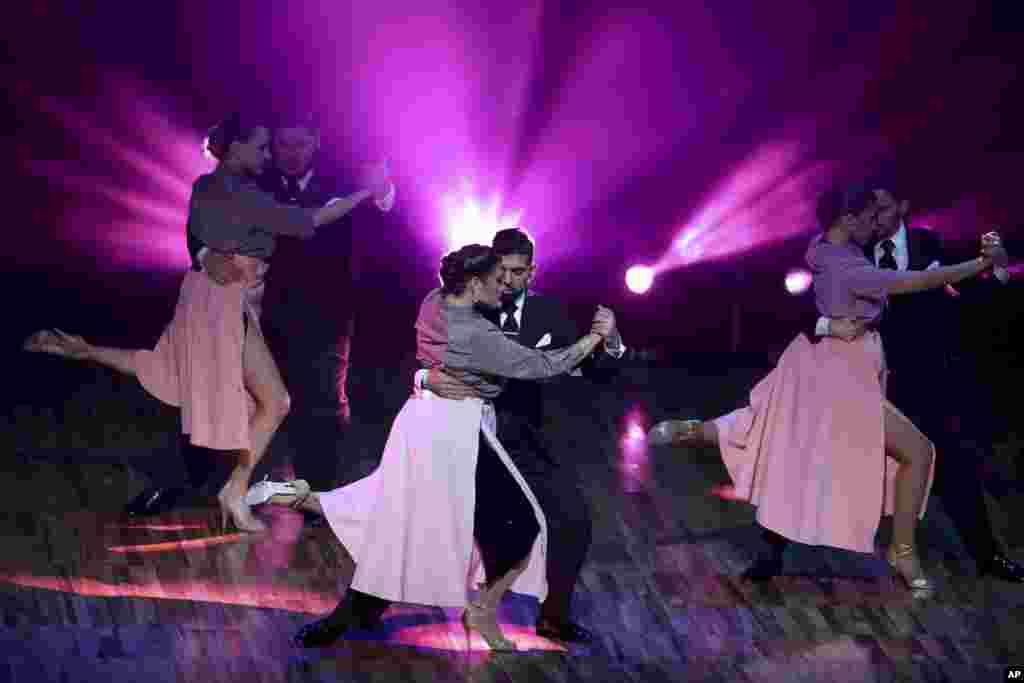 Couples dance during a show before the finals at the yearly Tango Dance World Championship in Buenos Aires, Argentina, Aug. 20, 2019.