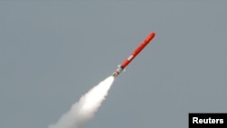 FILE - Pakistan's Babur Hatf VII cruise missile takes off during a test flight from an undisclosed location, July 26, 2007. 