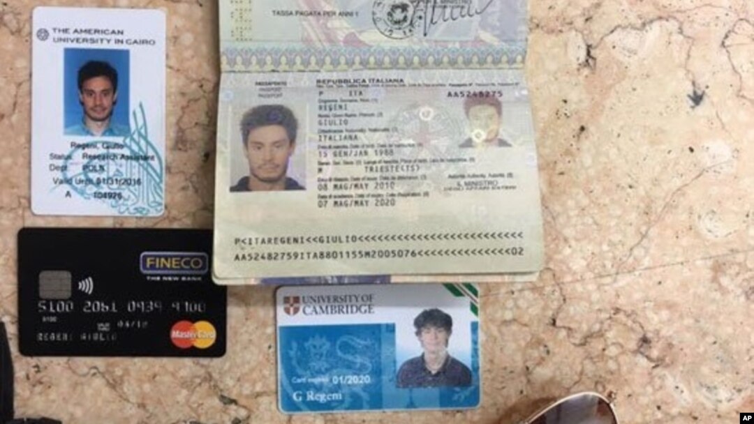 In this photo released by the Egyptian Ministry of Interior March 24, 2016, personal belongings of slain Italian graduate student Giulio Regeni, including his passport, are displayed.