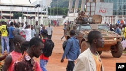 French peacekeeping soldiers, center right, patrol the city of Bangui, Central African Republic, Sept. 30, 2015.