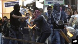 Kurdish demonstrators clash with riot police in Istanbul, May 16, 2011