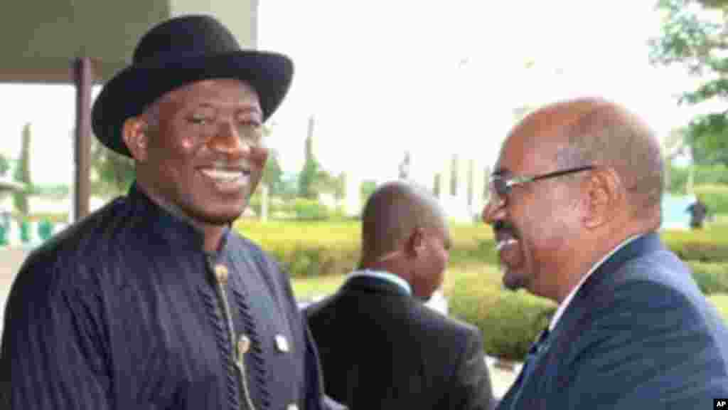  President Jonathan and Sudanese President al-Bashir shake hands before an African Union summit on health in Abuja.