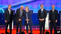 Democratic presidential candidates, from left, former Virginia Sen. Jim Webb, Sen. Bernie Sanders of Vermont, former Secretary of State Hillary Clinton, former Maryland Gov. Martin O'Malley and former Rhode Island Gov. Lincoln Chafee, take the stage befor