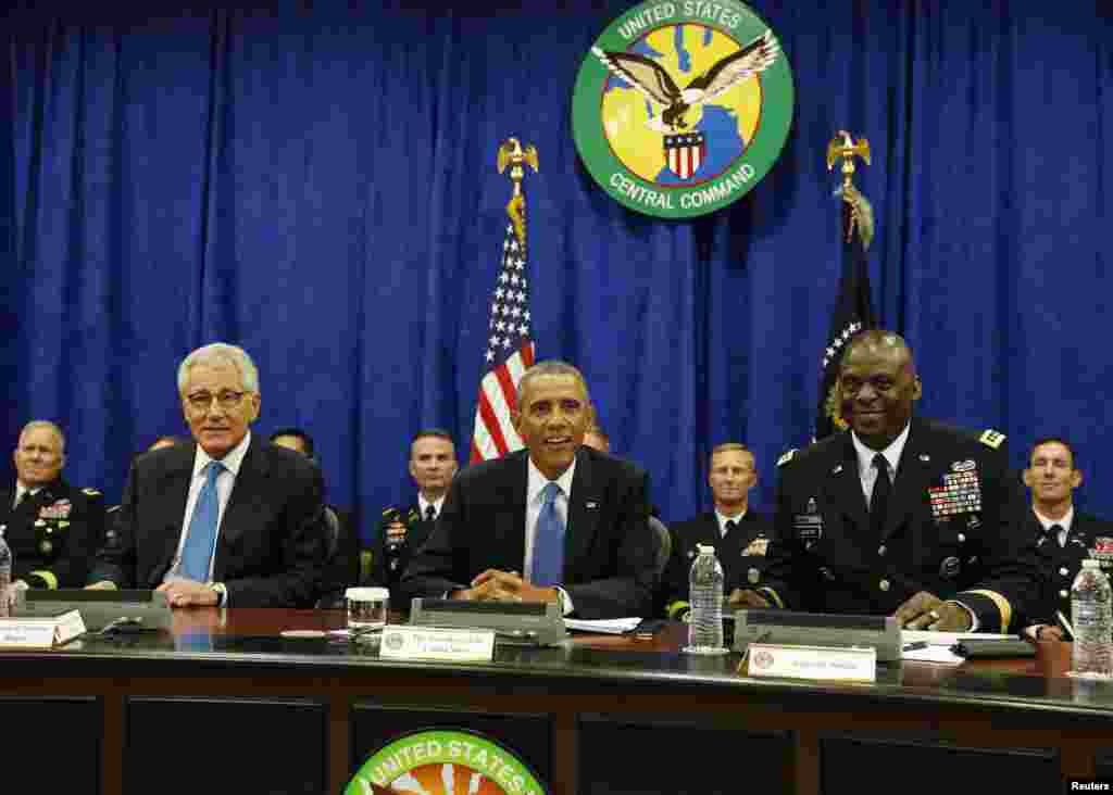 U.S. President Barack Obama, center, participates in a briefing from top military leaders at U.S. Central Command at MacDill Air Force Base in Tampa, Florida, Sept. 17, 2014.