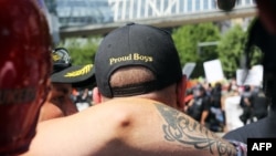 A person wears a hat of U.S. far-right men's organization Proud Boys during a campaign rally for Patriot Prayer founder and Republican Senate candidate Joey Gibson in Portland, Oregon, Aug. 4, 2018.