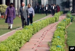 U.S. Secretary of State Rex Tillerson walks along side the path of the last steps of Mahatma Gandhi to the Martyr's Column, the site of the assassination Mahatma Gandhi, with director Dipankar Gyan, at the Gandhi Smriti, Oct. 25, 2017, in New Delhi, India.