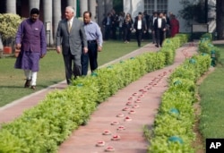 U.S. Secretary of State Rex Tillerson walks along side the path of the last steps of Mahatma Gandhi to the Martyr's Column, the site of the assassination Mahatma Gandhi, with director Dipankar Gyan, at the Gandhi Smriti, Oct. 25, 2017, in New Delhi, India.