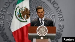 Mexico's President Enrique Peña Nieto delivers a message at the National Palace in downtown Mexico City, Oct. 6, 2014.