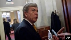 Rep. Roy Blunt, R-Mo., speaks to reporters as he walks into a meeting with the Republican Senate leadership on Capitol Hill, Feb. 11, 2019, in Washington.