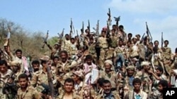 Yemeni soldiers and tribe members after a battle against al-Houthi Shiite rebels in northern Yemen. Al-Qaida is coordinating with the rebels battling Yemeni and Saudi government forces along the border, 24 Jan 2010