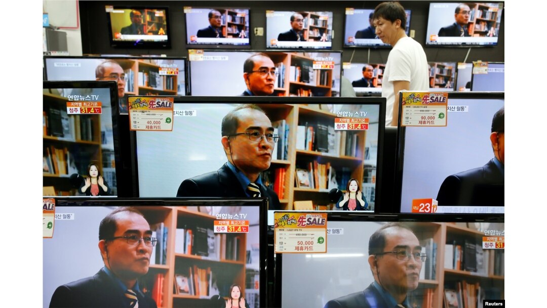 A customer watches TV sets broadcasting a news report on Thae Yong Ho, North Korea's former deputy ambassador in London, who defected with his family to South Korea, in Seoul, South Korea, Aug. 18, 2016.