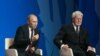 Russian President Vladimir Putin, left, and Iceland's President Olafur Ragnar Grimsson during the International Arctic Forum in Salekhard, a city 1,950 km northeast of Moscow just above the Arctic Circle, Russia, Sept. 25, 2013.