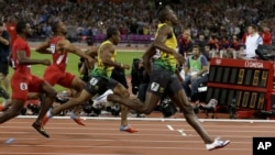 Jamaica's Usain Bolt, right, wins the men's 100-meter final during the athletics in the Olympic Stadium at the 2012 Summer Olympics, London, Sunday, Aug. 5, 2012.
