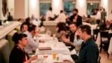 People eating at Gotham restaurant on December 14, 2021, in New York City. (AP Photo/Brittainy Newman)