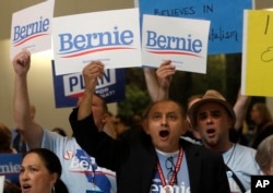 Supporters of Democratic presidential candidate Sen. Bernie Sanders, cheer during the 2019 California Democratic Party State Organizing Convention in San Francisco, June 2, 2019.