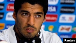 Uruguay's national soccer team player Luis Suarez attends a news conference prior a training session at the Dunas Arena soccer stadium in Natal, June 23, 2014.