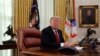 FILE - President Donald Trump answers questions from the media after speaking with members of the military by video conference on Christmas Day, Dec. 25, 2018, in the Oval Office of the White House. 