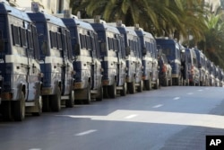 Riot police vans are lining streets around Algeria's capital during a protest in Algiers, Algeria, March 15, 2019.