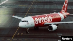 FILE - An AirAsia plane is seen on a runway at Kuala Lumpur International Airport in this August, 2014 image.