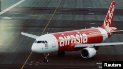 FILE - An AirAsia plane is seen on a runway at Kuala Lumpur International Airport in this August, 2014 image.