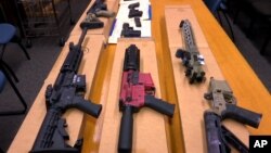 FILE - "Ghost guns" are on display at the San Francisco Police Department headquarters in this November 2019 photo. President Biden is expected to announce tighter regulations requiring buyers of ghost guns to undergo background checks, sources say.
