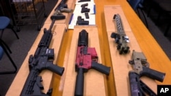 FILE - "Ghost guns" are on display at the San Francisco Police Department headquarters in this November 2019 photo. President Biden is expected to announce tighter regulations requiring buyers of ghost guns to undergo background checks, sources say.