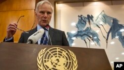 FILE - United Nations Special Rapporteur on extreme poverty and human rights, Philip Alston speaks during a news conference held in Beijing, China, Aug. 23, 2016. 