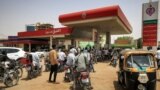 Motorcyclists queue-up for fuel at a gasl station in al-Amarat district of Sudan's capital Khartoum on June 10, 2021. 