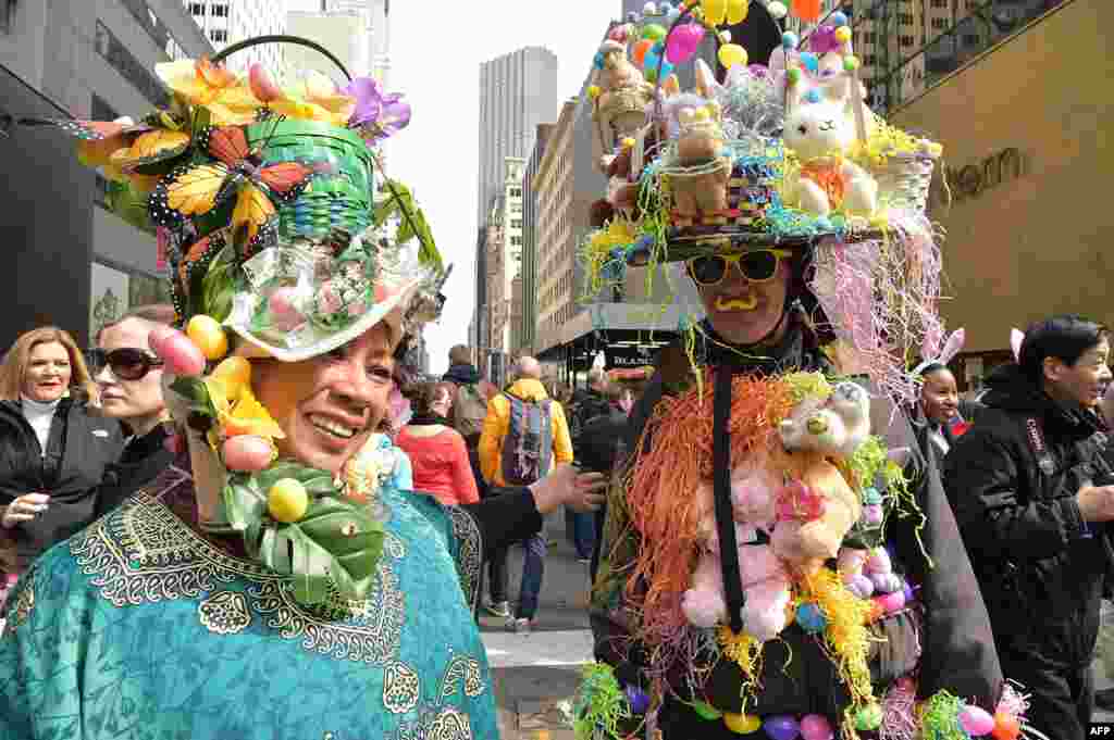 People show off their Easter finery as they walk down Fifth Avenue in New York during the annual Easter Parade and Easter Bonnet Festival.