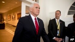 FILE - Vice President Mike Pence arrives for a news conference in the Rose Garden at the White House, June 7, 2018, in Washington.