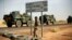 FILE - French armored vehicles head toward the Niger border before making a left turn north in Gao, northern Mali.
