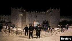 Israeli police officers stand guard outside the Damascus Gate, in Jerusalem, Dec. 4, 2021.