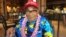 In this Dec. 5, 2016 photo, Ray Chavez, a Pearl Harbor survivor from Poway, California, pauses while eating breakfast in Honolulu.