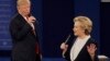 FILE - Republican presidential nominee Donald Trump and Democratic presidential nominee Hillary Clinton speak during the second presidential debate at Washington University in St. Louis, Sunday, Oct. 9, 2016. (AP Photo/Patrick Semansky)